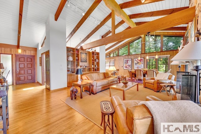 43 Chimney Pt, Lake Toxaway, NC 28747 - living room with wooden walls, wood finished floors, beam ceiling, and high vaulted ceiling