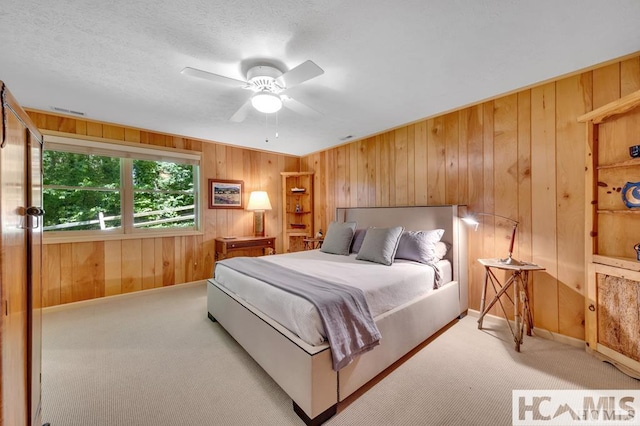 43 Chimney Pt, Lake Toxaway, NC 28747 - bedroom featuring wooden walls, light colored carpet, and ceiling fan