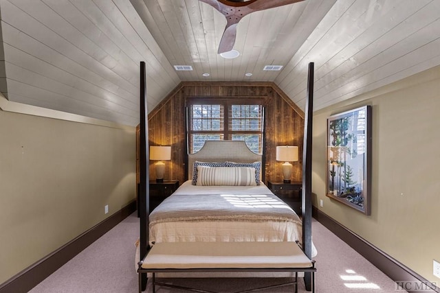 unfurnished bedroom with wood ceiling, carpet floors, and vaulted ceiling