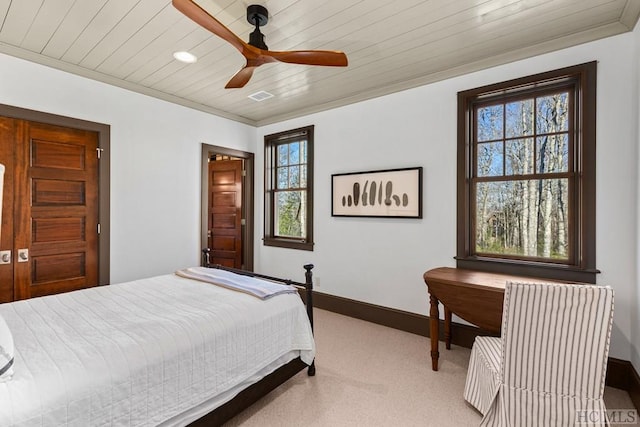 carpeted bedroom with multiple windows, radiator, wooden ceiling, and ceiling fan