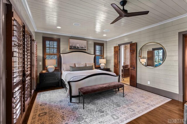 bedroom with hardwood / wood-style flooring, ornamental molding, and wooden ceiling