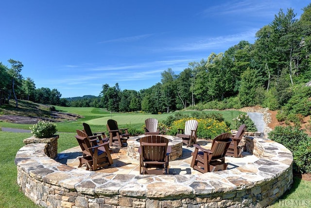 view of patio / terrace with an outdoor fire pit