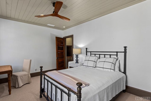 bedroom with ornamental molding, light carpet, wood ceiling, and ceiling fan