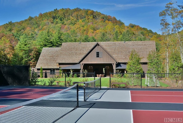 view of tennis court with basketball court