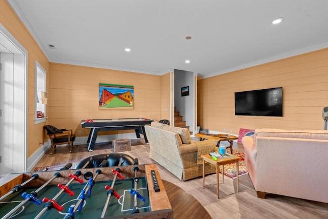 recreation room featuring recessed lighting, crown molding, and wood finished floors