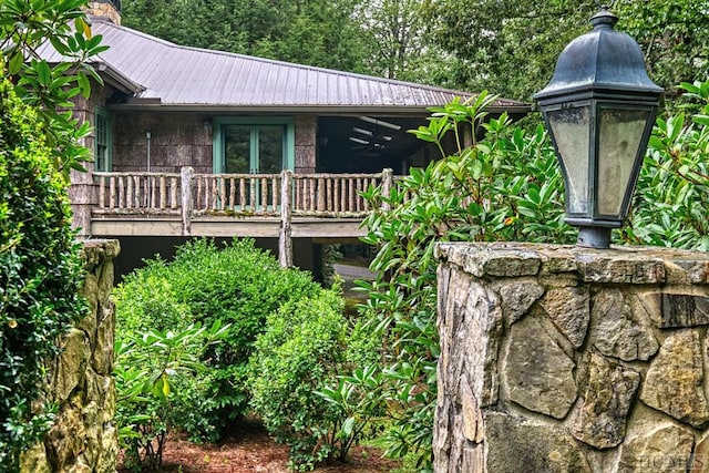 view of side of home featuring metal roof