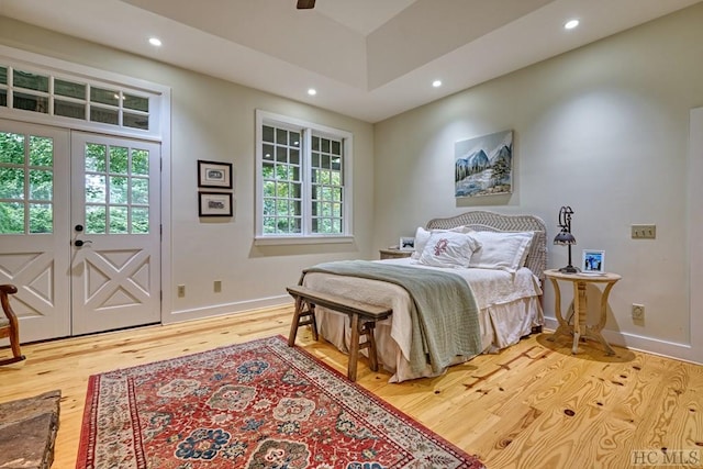 bedroom featuring recessed lighting, wood finished floors, and baseboards