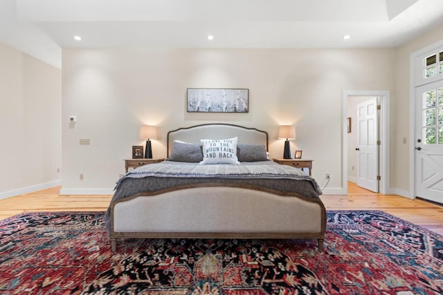 bedroom featuring recessed lighting, baseboards, and wood finished floors