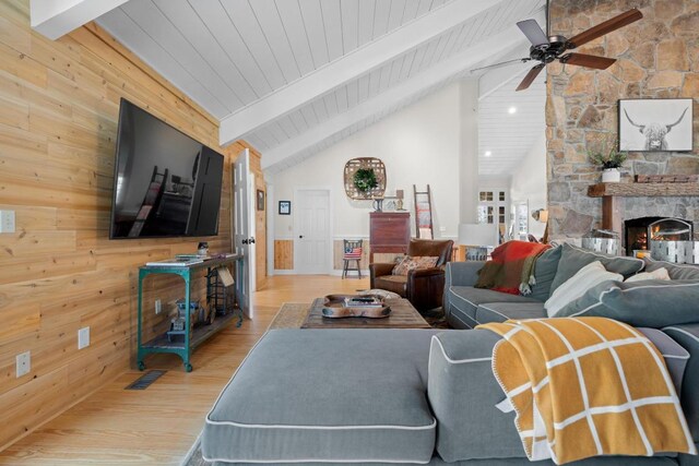 living area featuring wood finished floors, french doors, and baseboards