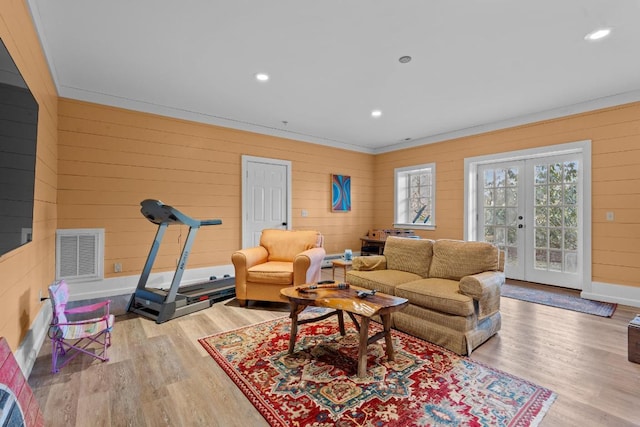 living room featuring wood finished floors, recessed lighting, french doors, and visible vents