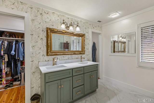 bathroom with vanity and crown molding