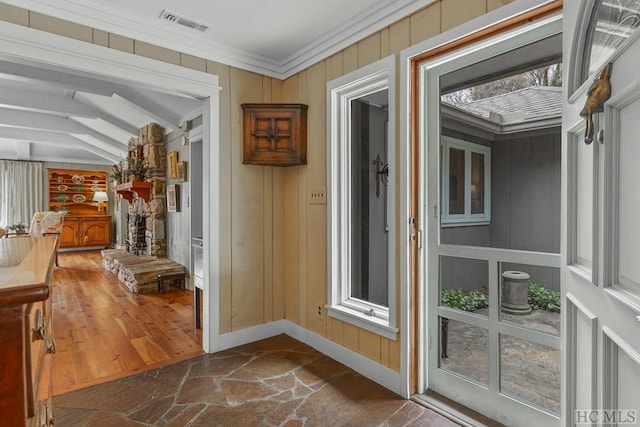 doorway to outside featuring lofted ceiling