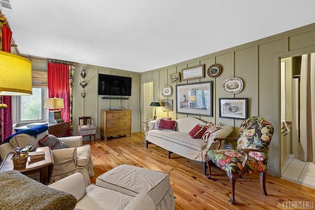 living room with light hardwood / wood-style flooring