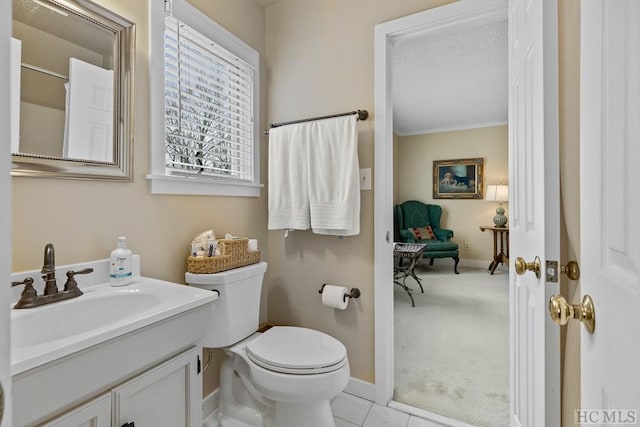 bathroom with tile patterned floors, toilet, and vanity