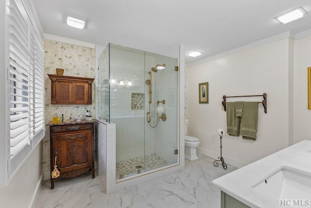 bathroom featuring an enclosed shower, vanity, and toilet