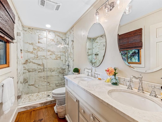 145 Island Point Rd, Lake Toxaway, NC 28747 - full bathroom with a marble finish shower, toilet, wood finished floors, double vanity, and recessed lighting