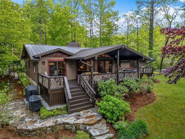 145 Island Point Rd, Lake Toxaway, NC 28747 - rustic home featuring a chimney, metal roof, a standing seam roof, and stairs