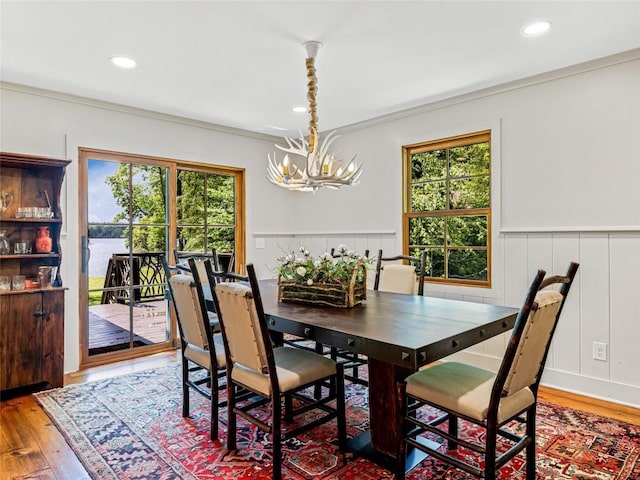 145 Island Point Rd, Lake Toxaway, NC 28747 - dining room featuring a chandelier, wood finished floors, crown molding, a wainscoted wall, and recessed lighting