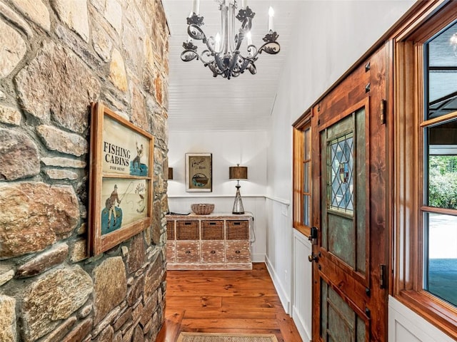 145 Island Point Rd, Lake Toxaway, NC 28747 - foyer with hardwood / wood-style floors, a chandelier, wainscoting, vaulted ceiling, and wooden ceiling