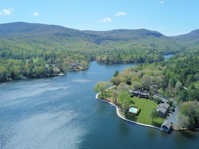 drone / aerial view with a water and mountain view