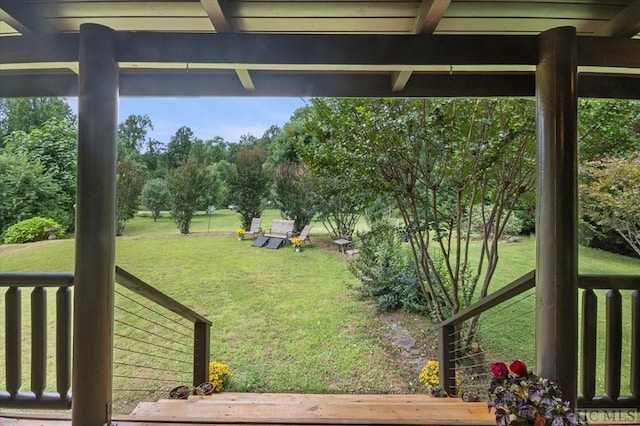 view of yard featuring a wooden deck