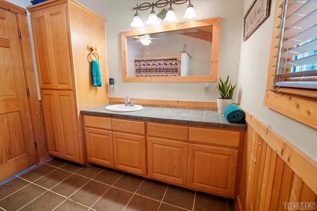 bathroom featuring tile patterned flooring, vanity, and ceiling fan