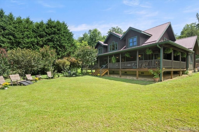 rear view of house with a lawn