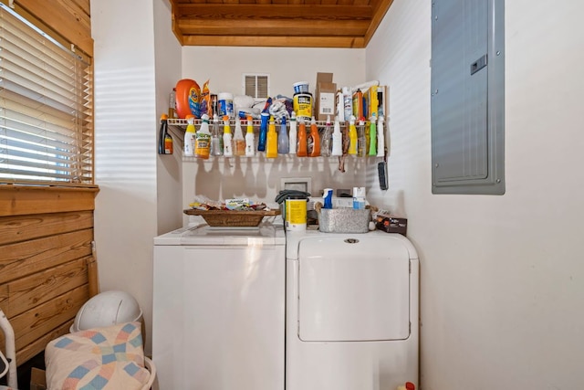 clothes washing area featuring separate washer and dryer, electric panel, and visible vents