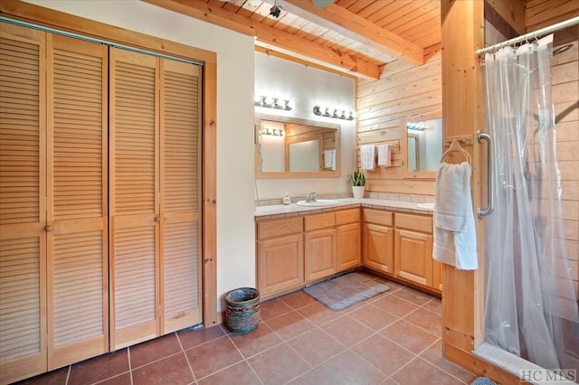 bathroom with wood ceiling, tile patterned floors, beamed ceiling, and wood walls