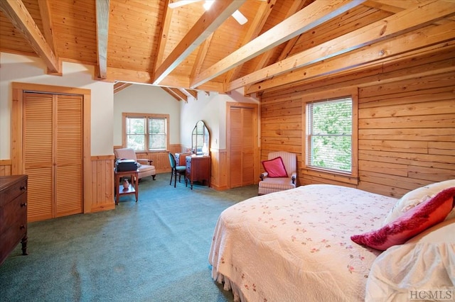 bedroom featuring carpet floors, multiple windows, wood ceiling, and wooden walls