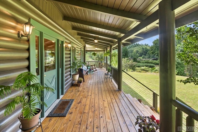 deck featuring a lawn and covered porch