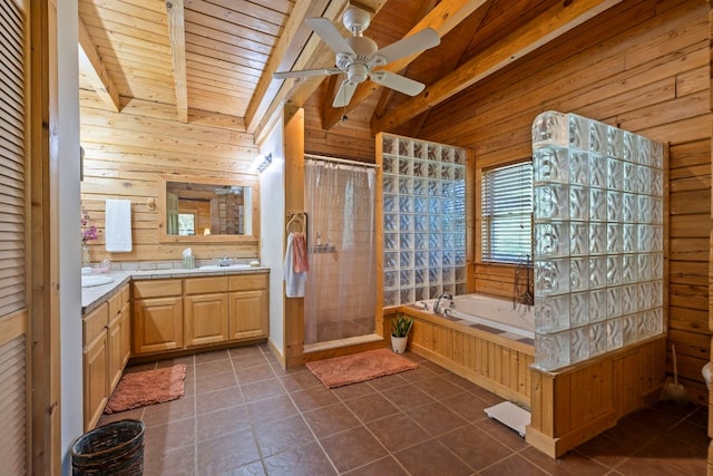 full bathroom with tile patterned floors, a bath, wooden walls, and a shower stall