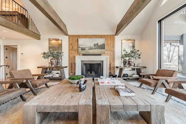 living room featuring a fireplace and beamed ceiling