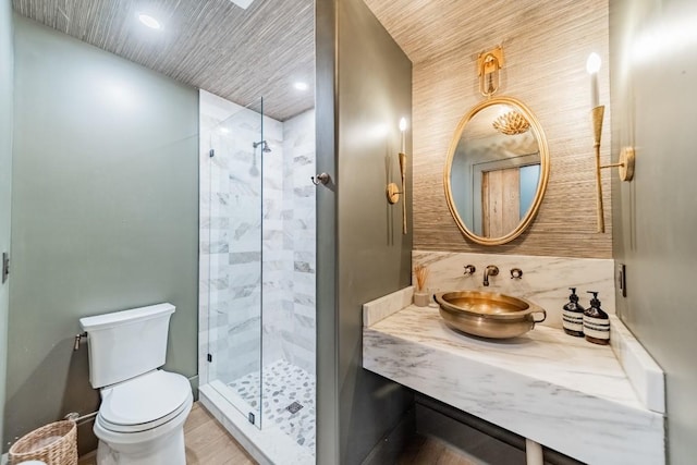 full bath with toilet, a stall shower, recessed lighting, and vanity