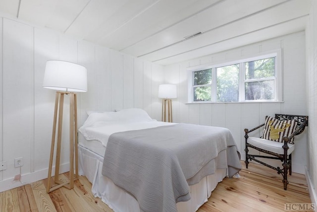 bedroom with visible vents and light wood finished floors