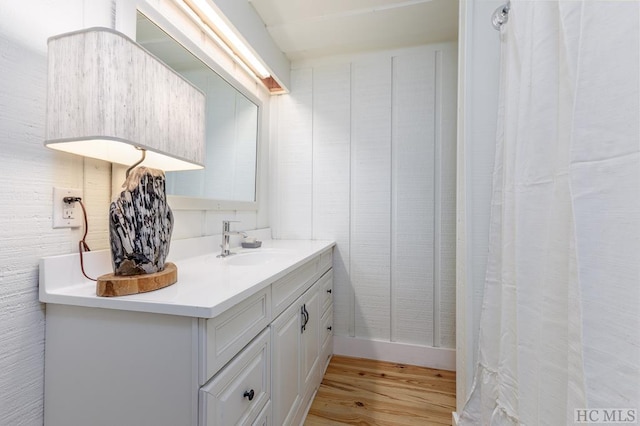 bathroom featuring vanity and wood finished floors
