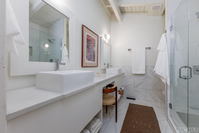 full bathroom featuring visible vents, vanity, beamed ceiling, tile walls, and a stall shower