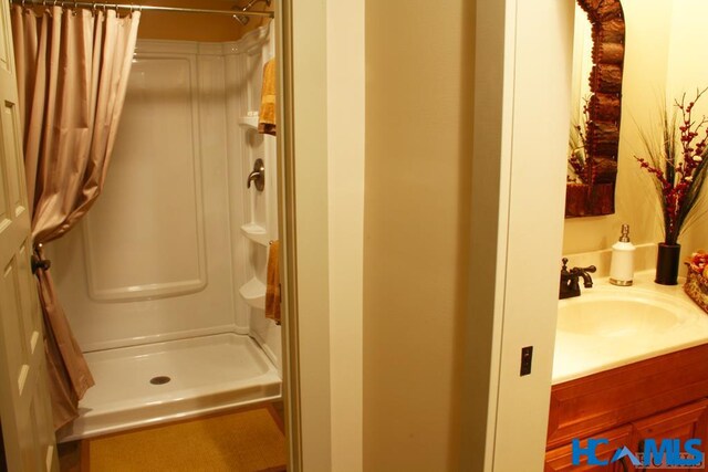 178 Whetstone Gap Rd, Lake Toxaway, NC 28747 - bathroom with curtained shower and vanity
