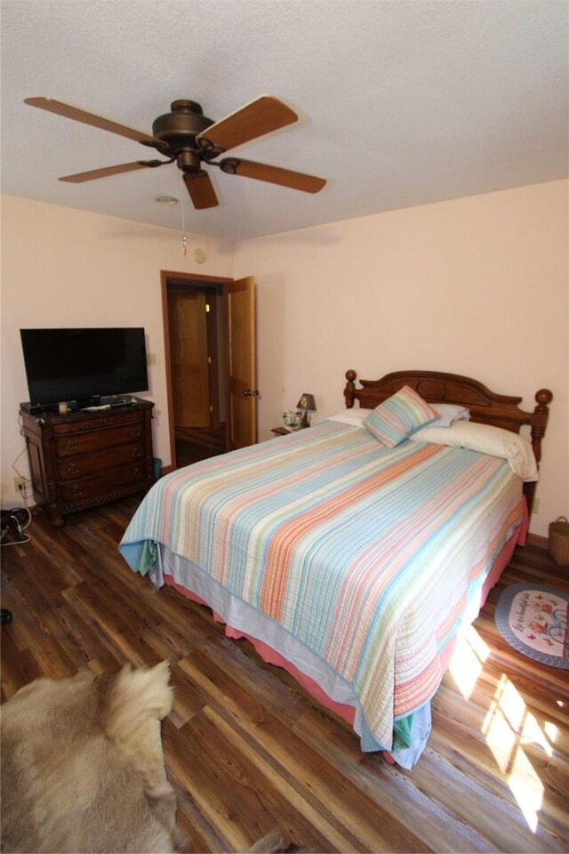 bedroom with ceiling fan and wood finished floors