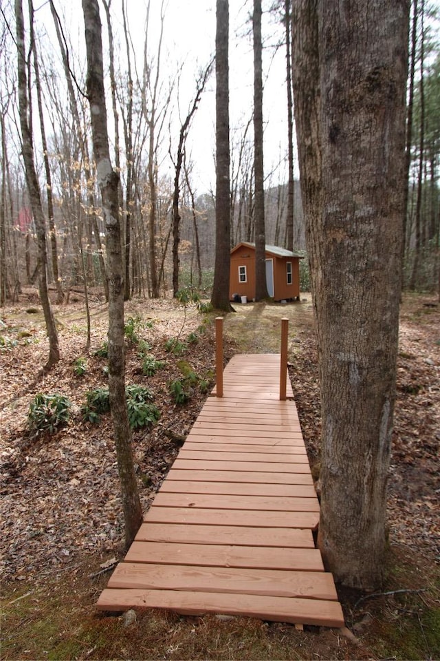 view of home's community featuring an outbuilding