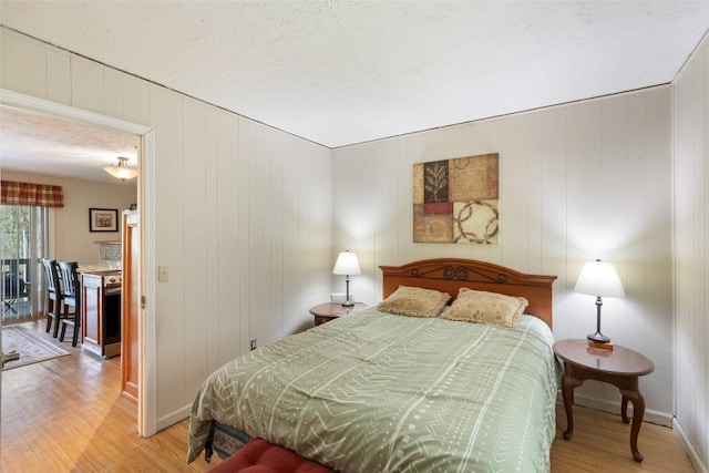 165 Hawks Nest Ln Unit 5, Highlands, NC 28741 - bedroom with baseboards and wood finished floors