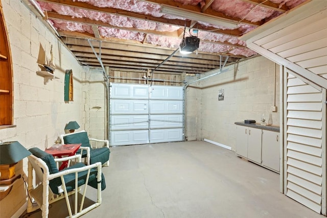 165 Hawks Nest Ln Unit 5, Highlands, NC 28741 - garage featuring concrete block wall and a garage door opener