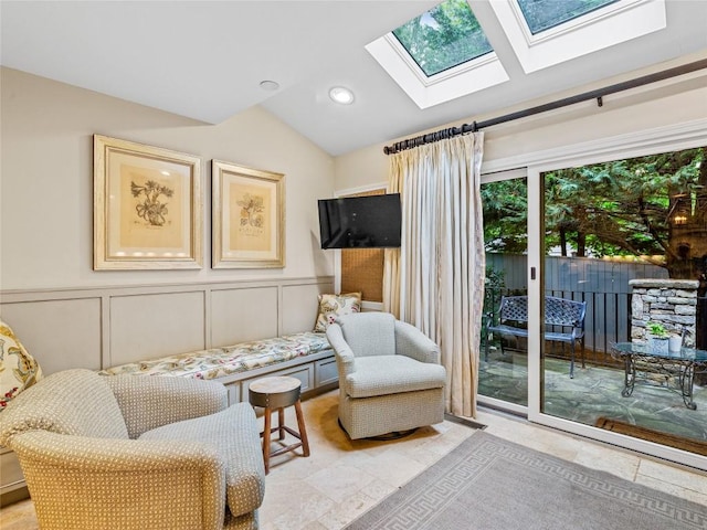 64 Toxaway Shrs Unit 2, Lake Toxaway, NC 28747 - living area featuring a skylight, vaulted ceiling, a decorative wall, wainscoting, and recessed lighting