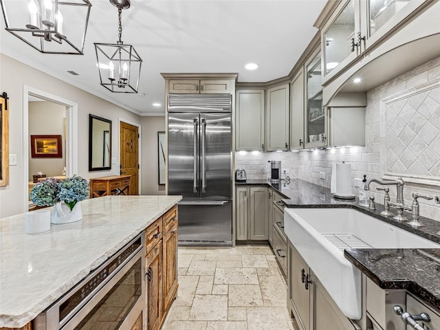 64 Toxaway Shrs Unit 2, Lake Toxaway, NC 28747 - kitchen with built in appliances, crown molding, a chandelier, recessed lighting, and gray cabinets