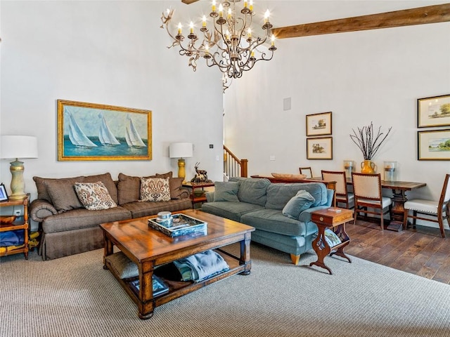 64 Toxaway Shrs Unit 2, Lake Toxaway, NC 28747 - living room with a chandelier, stairs, hardwood / wood-style flooring, beamed ceiling, and a towering ceiling