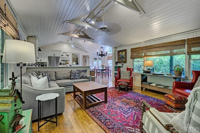 living room with wooden ceiling, light hardwood / wood-style floors, rail lighting, and lofted ceiling