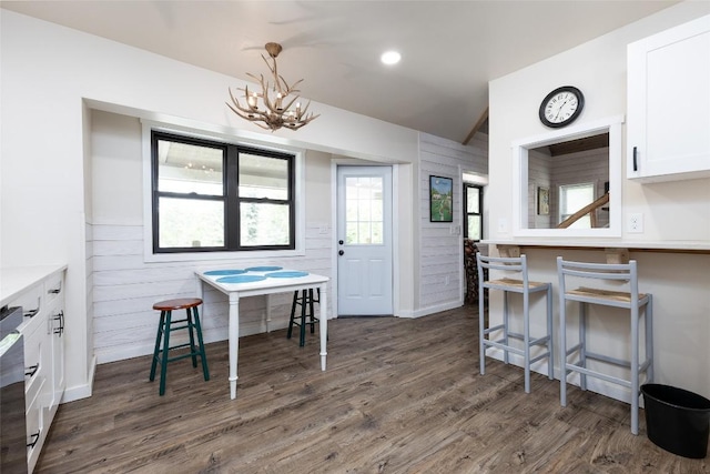 67 Chipmunk Trl, Glenville, NC 28736 - dining area featuring a chandelier, dark wood-type flooring, and wooden walls