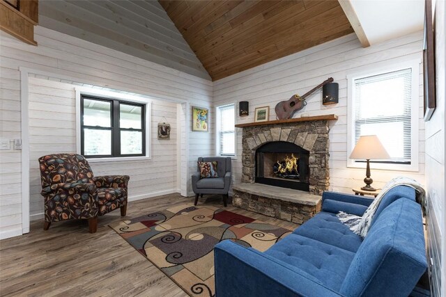 67 Chipmunk Trl, Glenville, NC 28736 - living area featuring vaulted ceiling, wooden ceiling, a stone fireplace, wood finished floors, and wooden walls