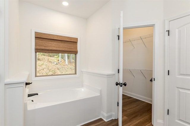 44 No End Cir, Cullowhee, NC 28723 - bathroom with wood finished floors, a garden tub, a spacious closet, and recessed lighting