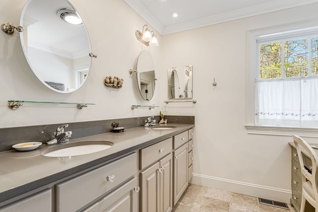 bathroom with ornamental molding, baseboards, double vanity, and recessed lighting